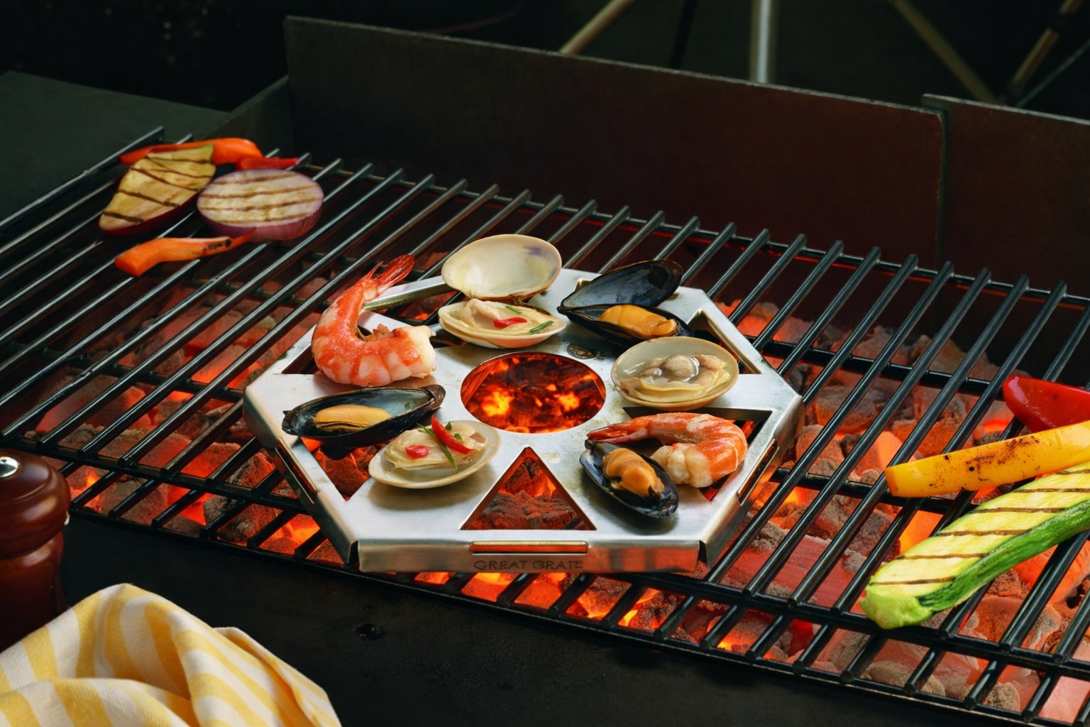 The Small Hexagonal Great Grate loaded with shrimp, clams, mussels and oysters, grilling over hot coals